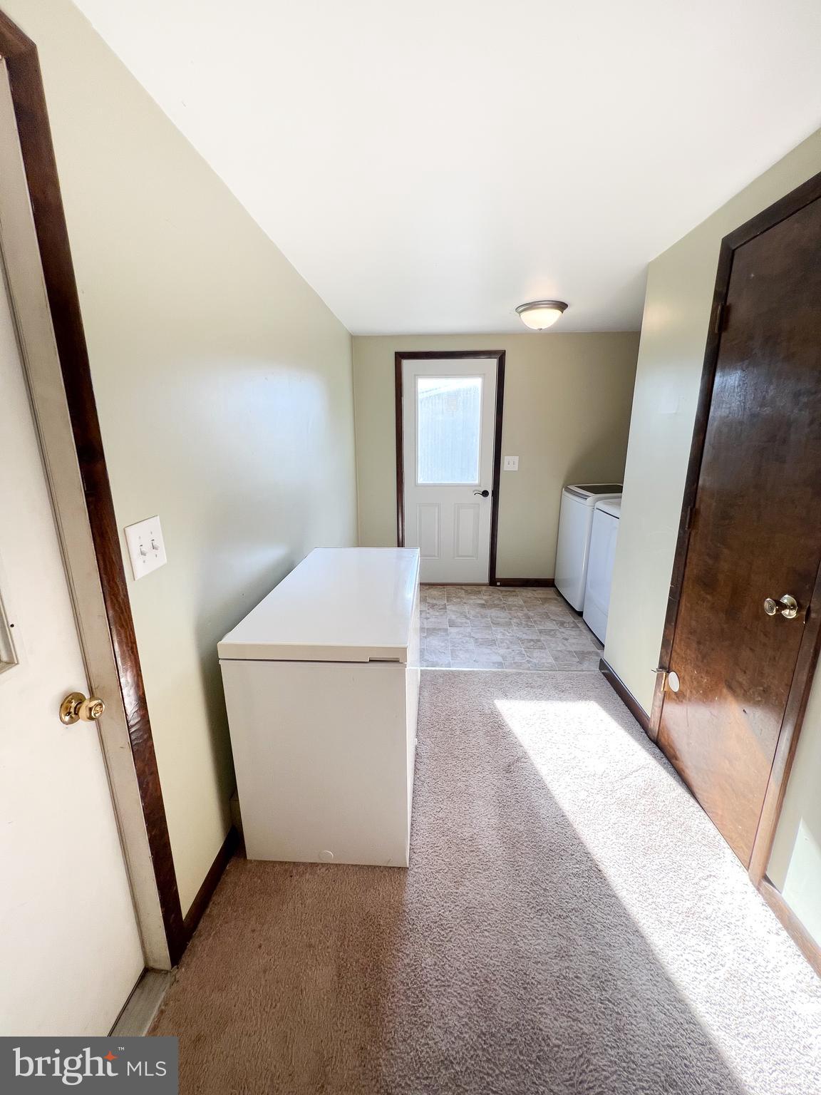 34 Cayuga Road Belleville, PA 17004 - Photo 15 of 46 a view of a hallway with a white car parked