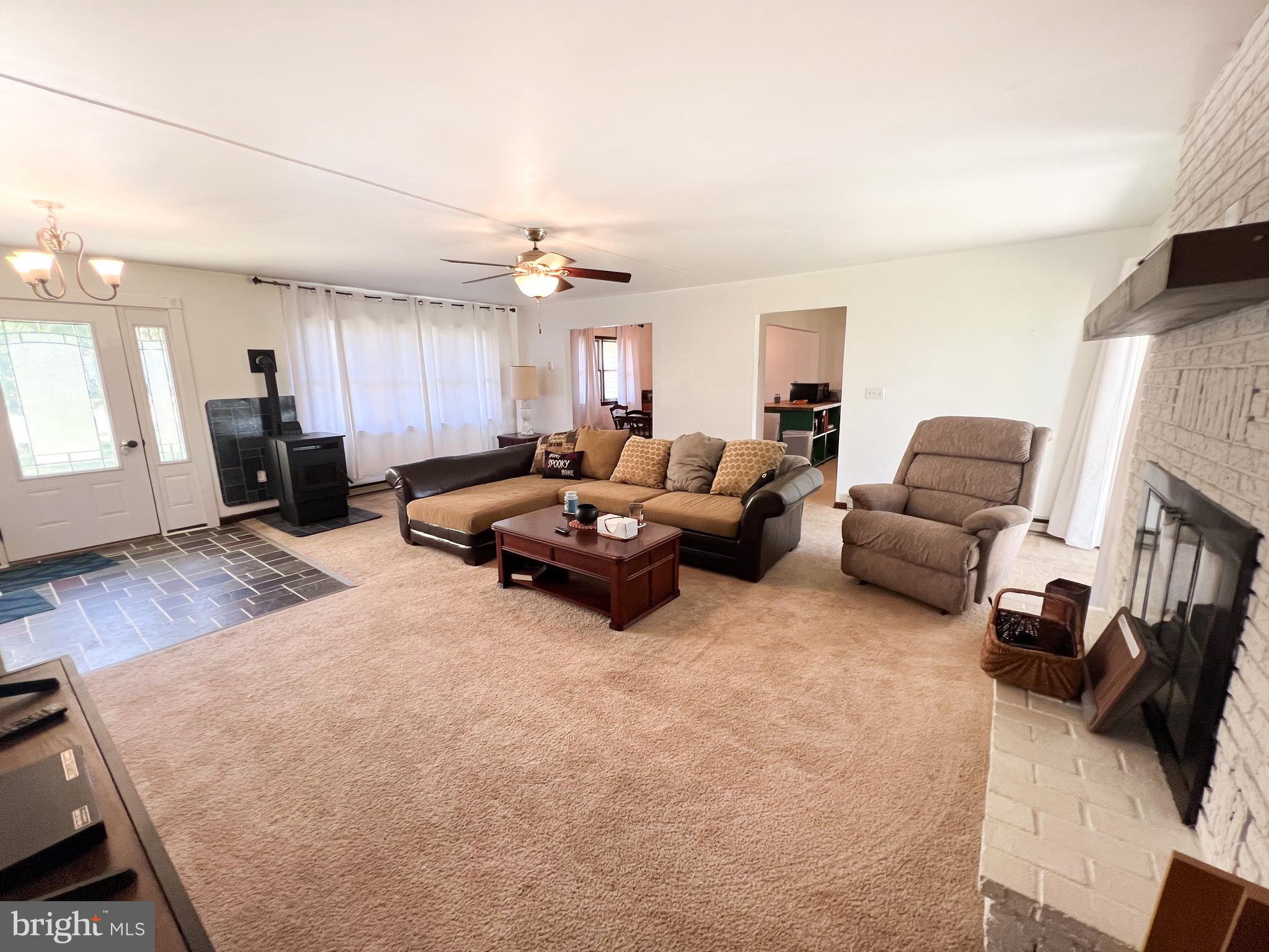 34 Cayuga Road Belleville, PA 17004 - Photo 2 of 46 a living room with furniture and a flat screen tv