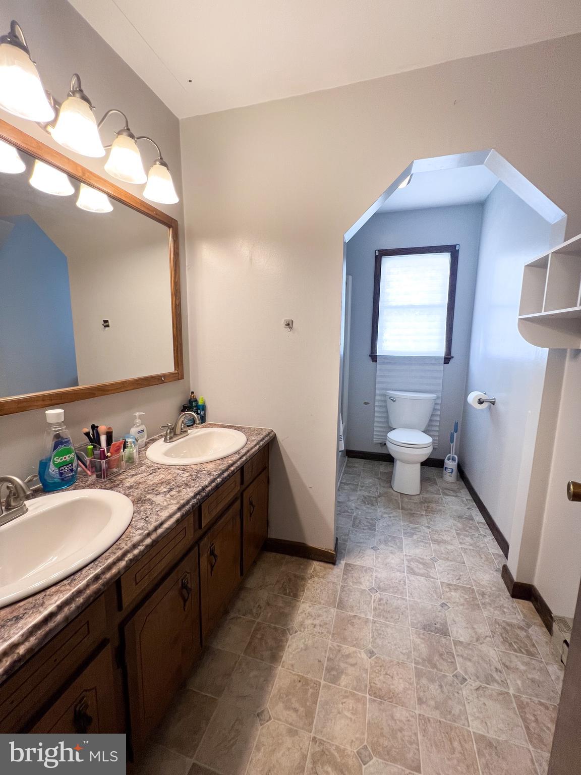 34 Cayuga Road Belleville, PA 17004 - Photo 24 of 46 a bathroom with a sink a toilet and mirror