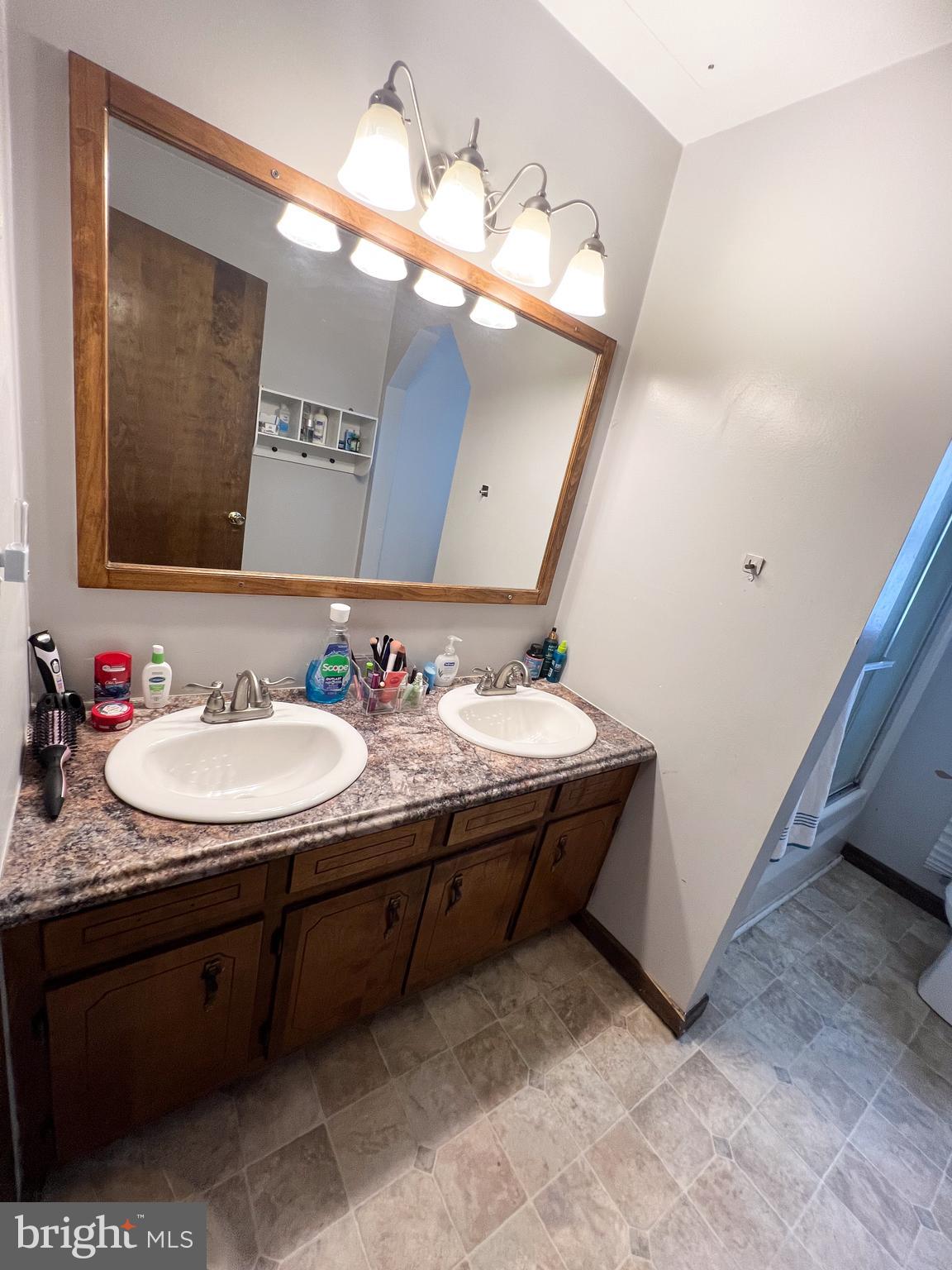 34 Cayuga Road Belleville, PA 17004 - Photo 25 of 46 a bathroom with a sink and a mirror