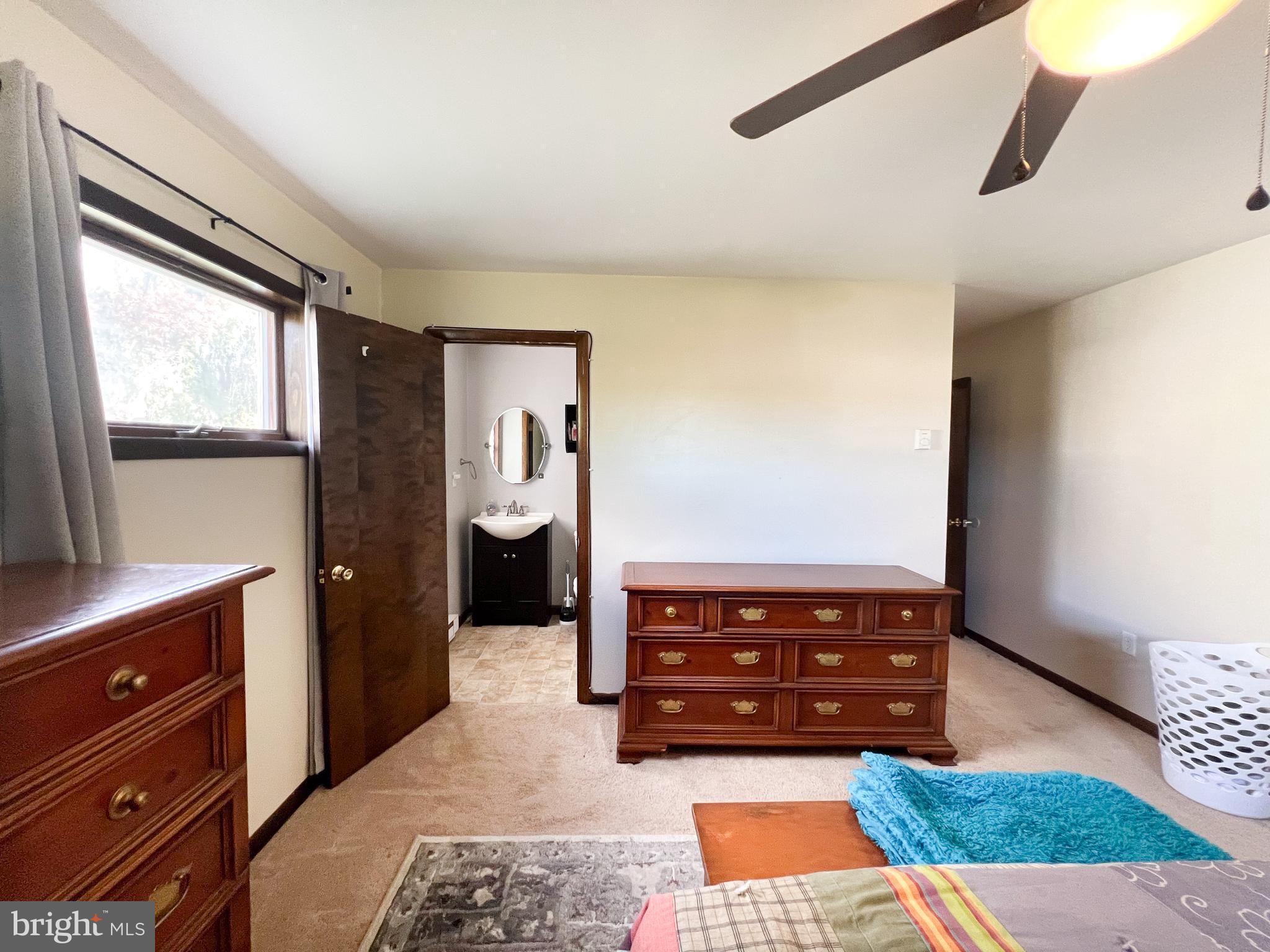 34 Cayuga Road Belleville, PA 17004 - Photo 29 of 46 a living room with furniture and a window