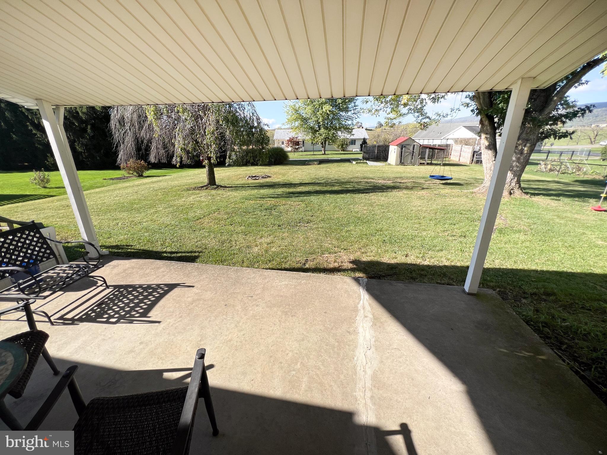 34 Cayuga Road Belleville, PA 17004 - Photo 36 of 46 a view of a backyard with table and chairs