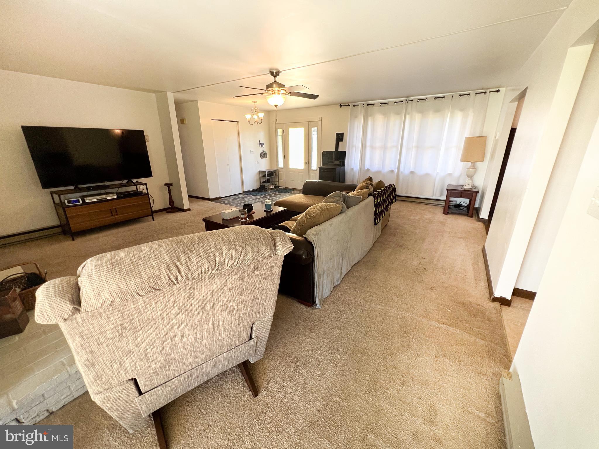 34 Cayuga Road Belleville, PA 17004 - Photo 4 of 46 a living room with furniture and a flat screen tv