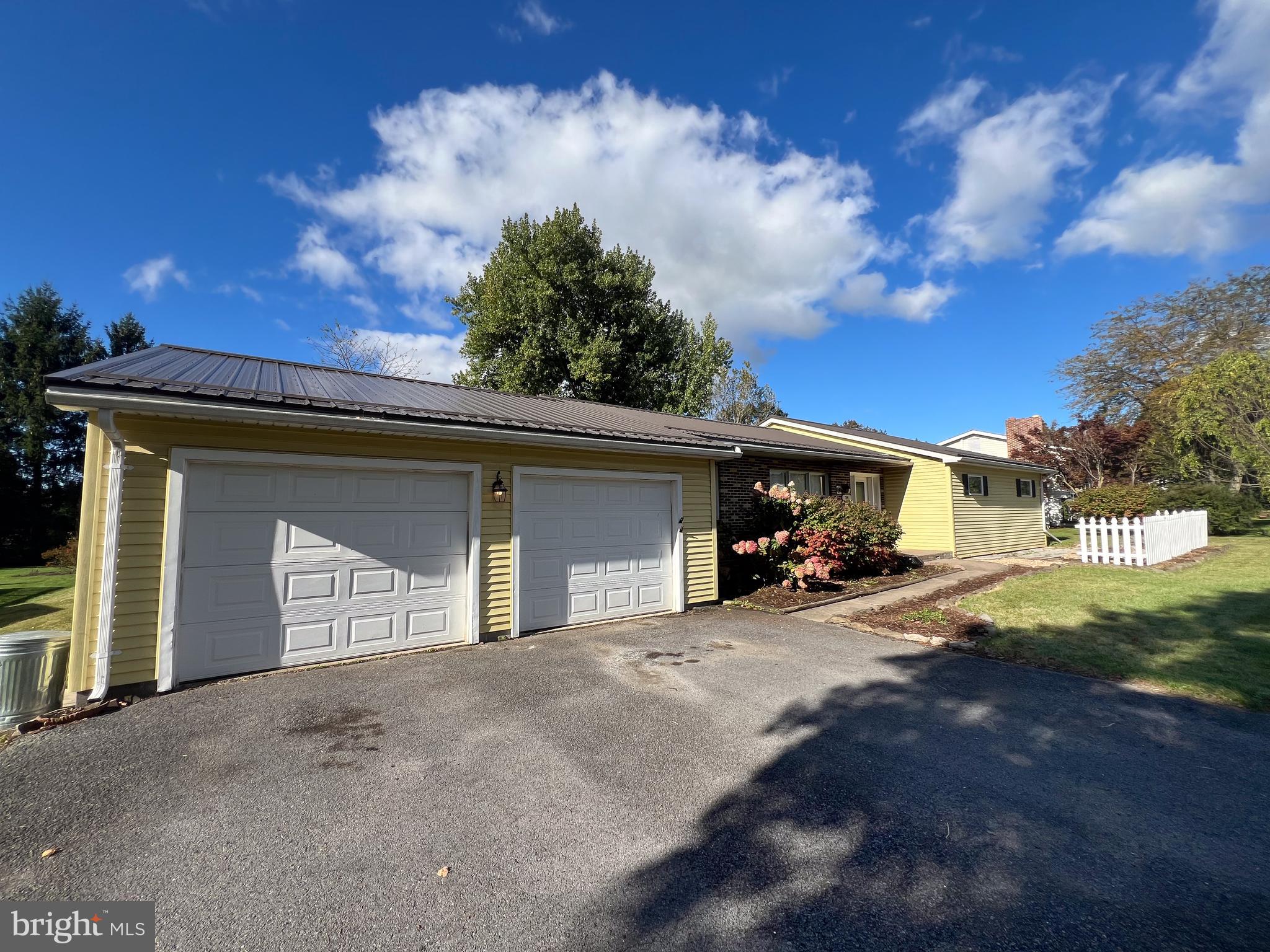 34 Cayuga Road Belleville, PA 17004 - Photo 44 of 46 a view of a house with a yard and garage