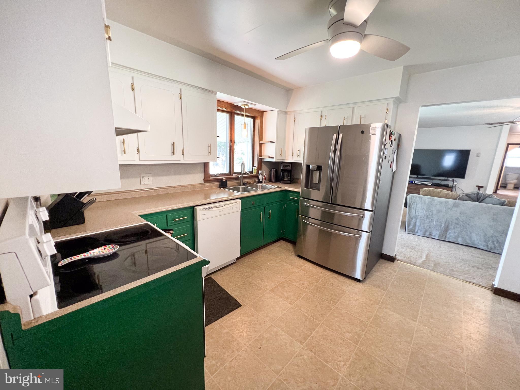 34 Cayuga Road Belleville, PA 17004 - Photo 8 of 46 a kitchen with kitchen island a counter top space cabinets and stainless steel appliances