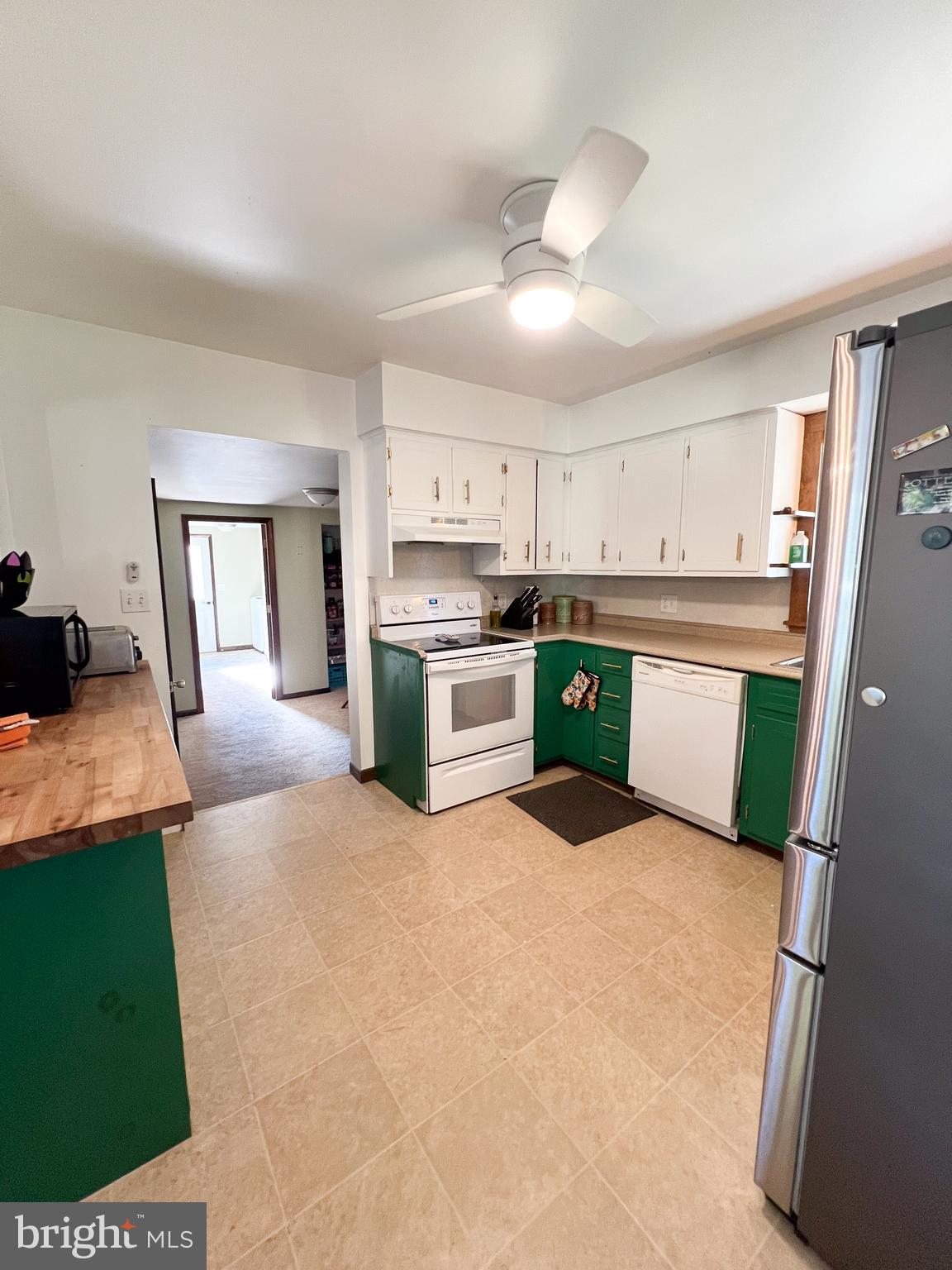 34 Cayuga Road Belleville, PA 17004 - Photo 9 of 46 a kitchen with stainless steel appliances granite countertop a refrigerator a stove and a sink