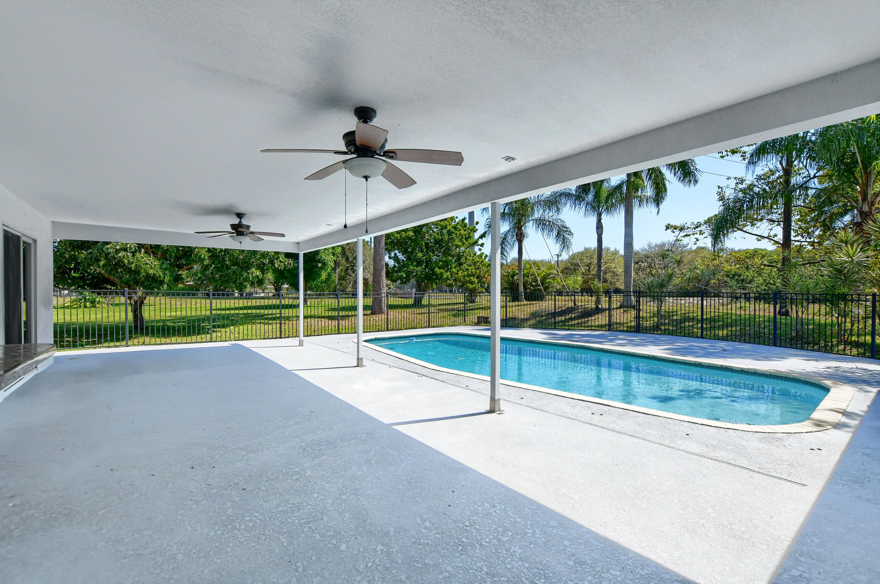 2334 Timbercreek Circle Northwest Boca Raton, FL 33431 - Photo 23 of 53 Covered Patio