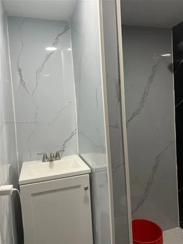 a bathroom with sink and toilet