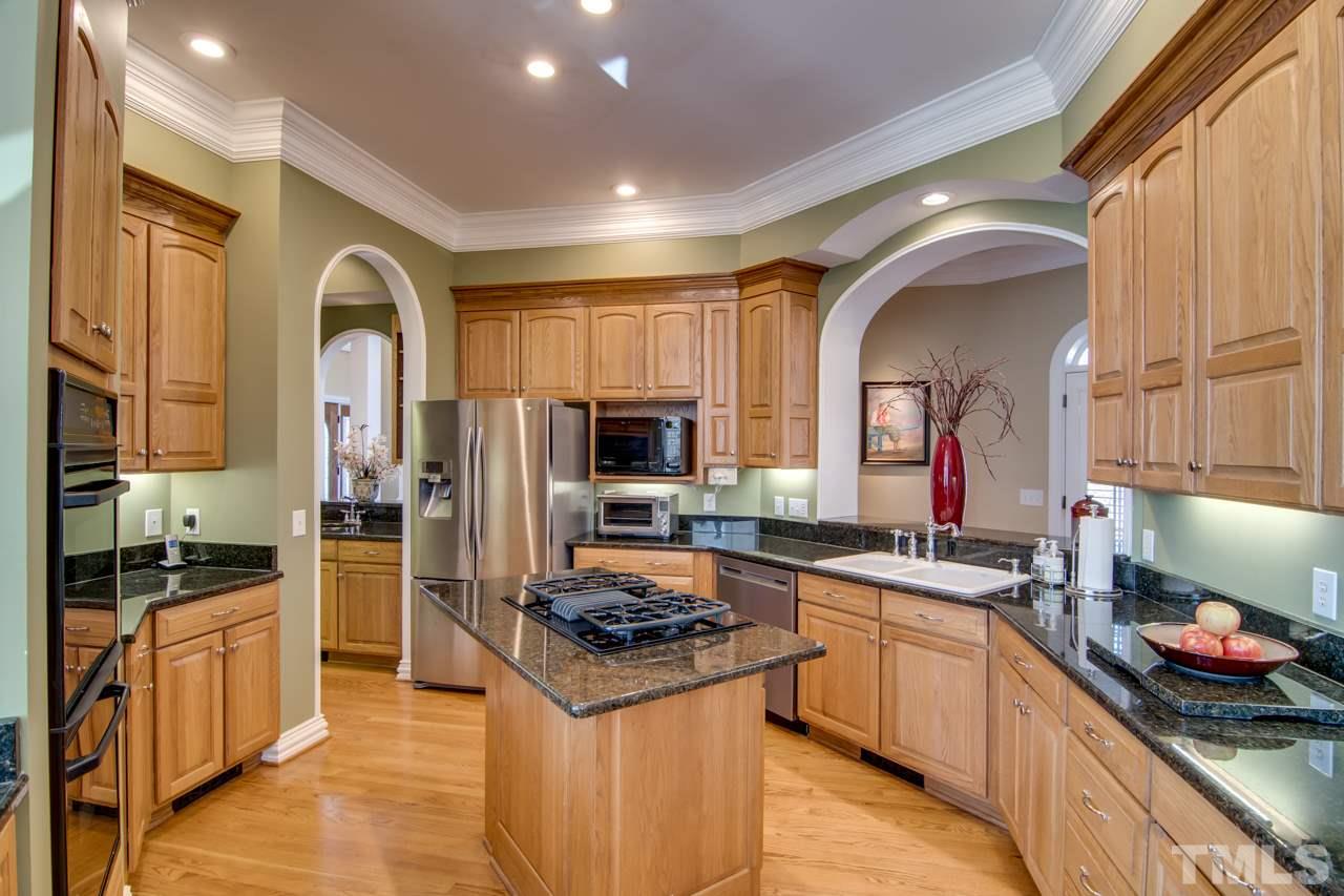 824 Rivers Edge Drive Graham, NC 27253 - Photo 11 of 30 a kitchen with a sink cabinets and stainless steel appliances