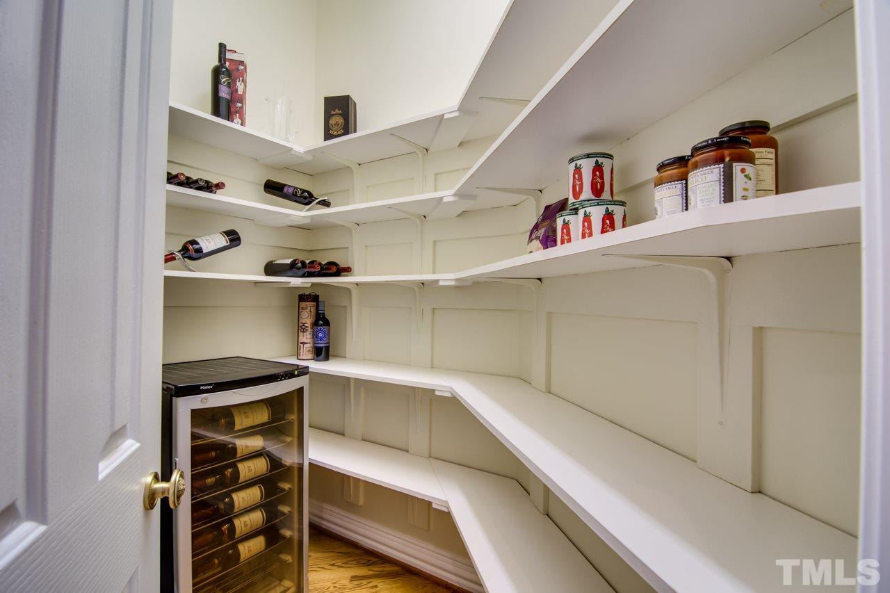 824 Rivers Edge Drive Graham, NC 27253 - Photo 12 of 30 a view of kitchen cabinets with food items with white countertops