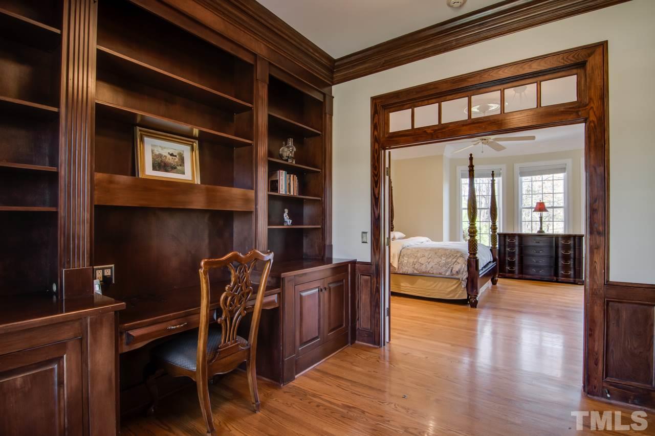 824 Rivers Edge Drive Graham, NC 27253 - Photo 14 of 30 a hallway with a workspace