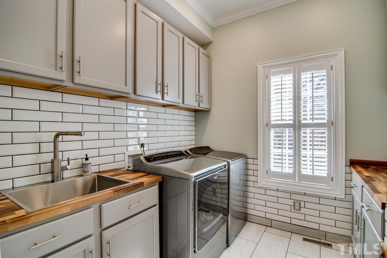 824 Rivers Edge Drive Graham, NC 27253 - Photo 19 of 30 a kitchen that has a sink and a stove