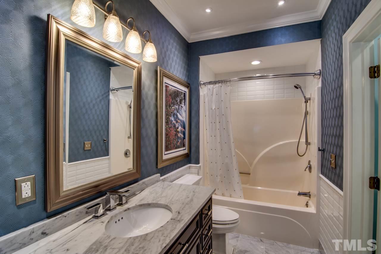 824 Rivers Edge Drive Graham, NC 27253 - Photo 22 of 30 a bathroom with a granite countertop sink mirror bathtub and shower