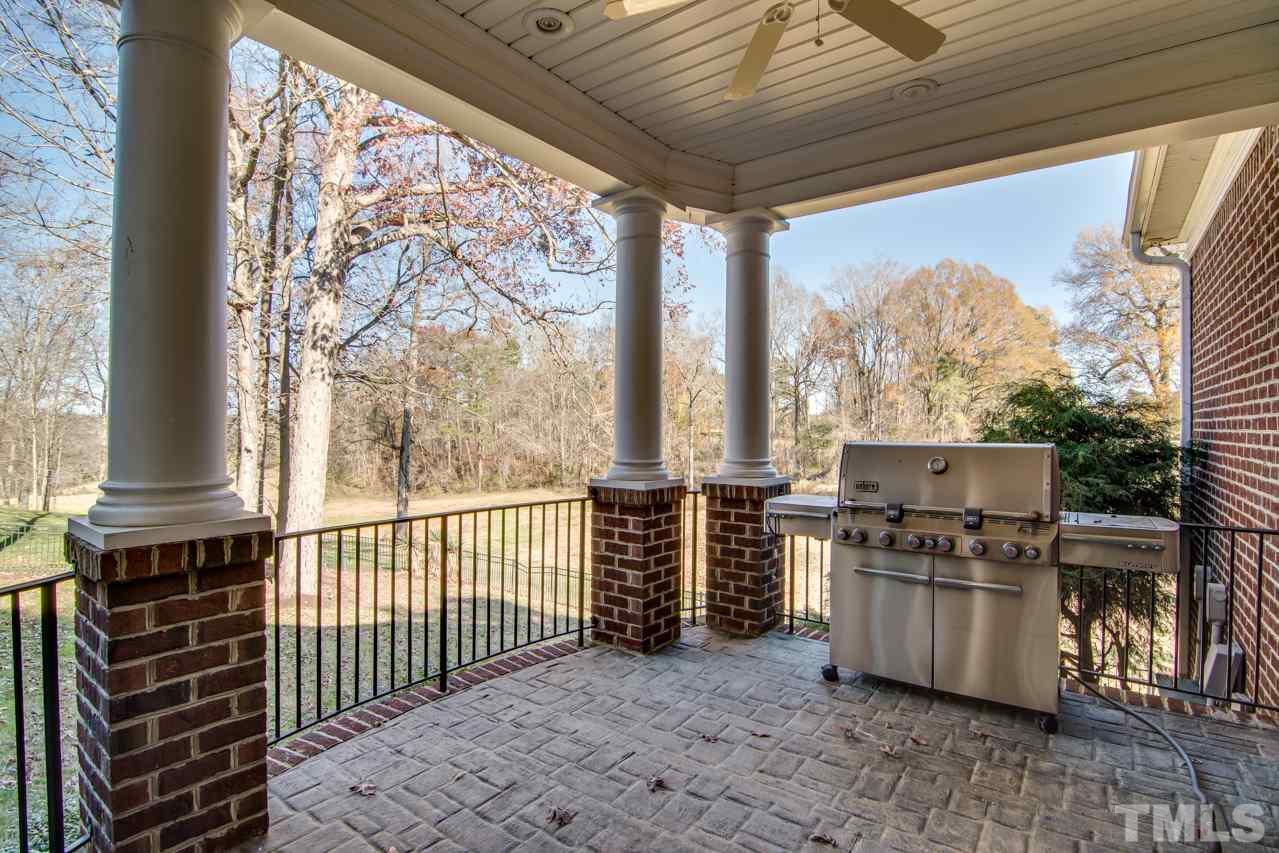 824 Rivers Edge Drive Graham, NC 27253 - Photo 27 of 30 a kitchen with stainless steel appliances a stove top oven and a refrigerator