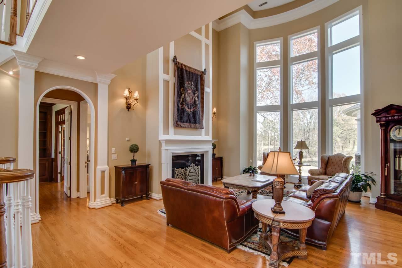 824 Rivers Edge Drive Graham, NC 27253 - Photo 4 of 30 a living room with fireplace furniture and a large window