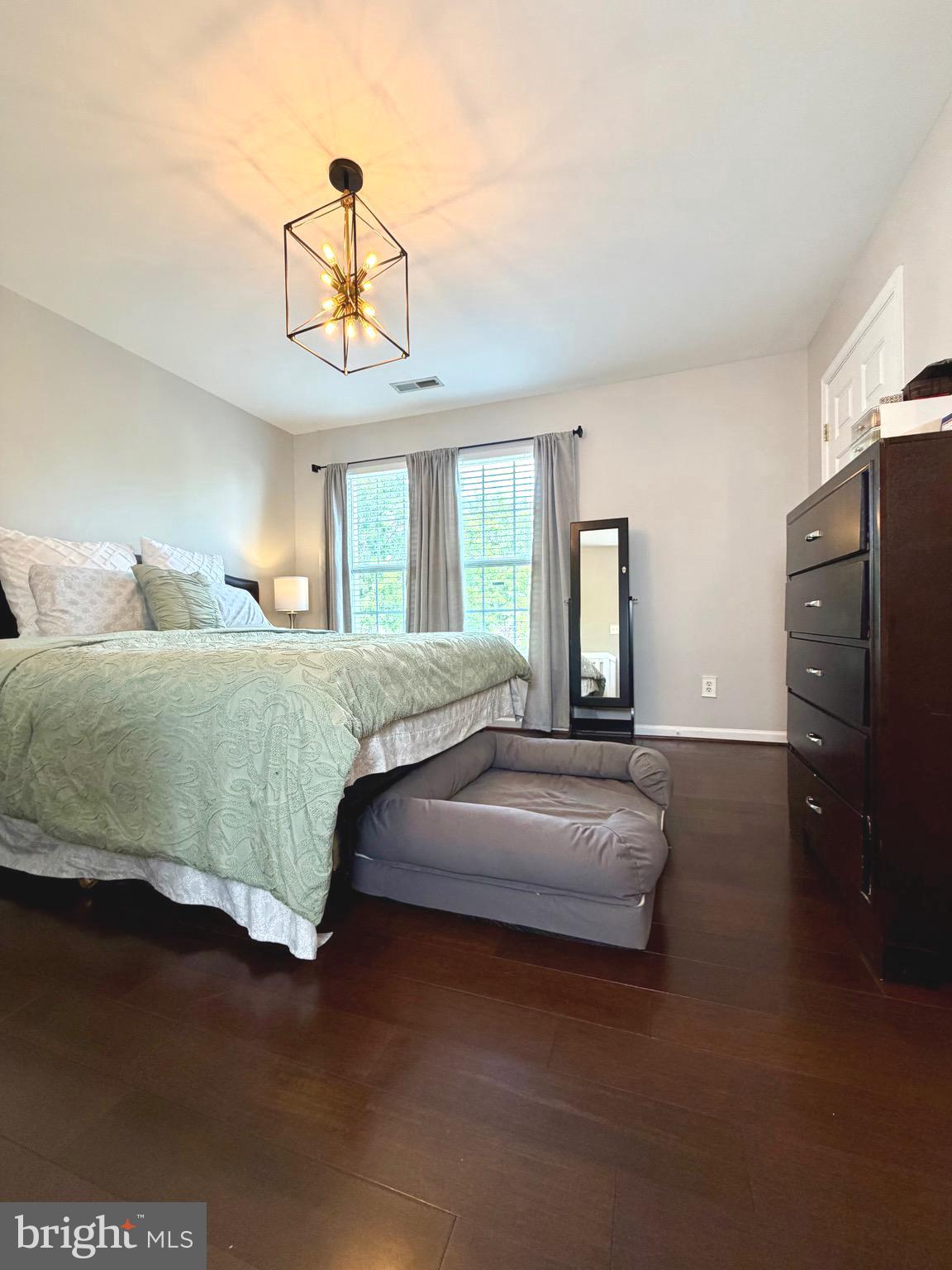 7108 Wheeling Way Gainesville, VA 20155 - Photo 28 of 45 a bedroom with a bed ceiling fan and a window
