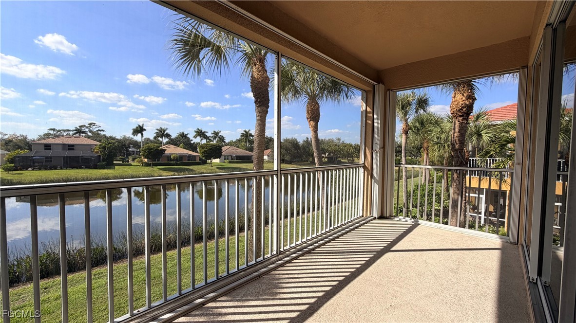 13071 Sandy Key Bend, Unit 304 North Fort Myers, FL 33903 - Photo 13 of 37 a view of balcony with wooden floor and fence