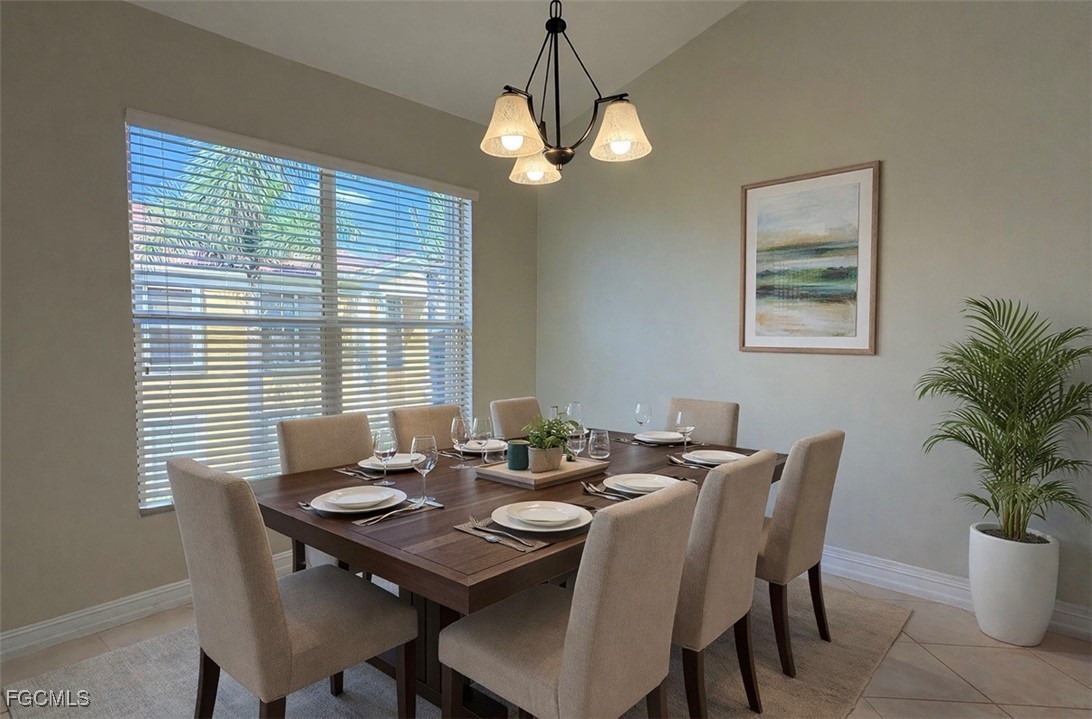 13071 Sandy Key Bend, Unit 304 North Fort Myers, FL 33903 - Photo 16 of 37 a view of a dining room with furniture and window