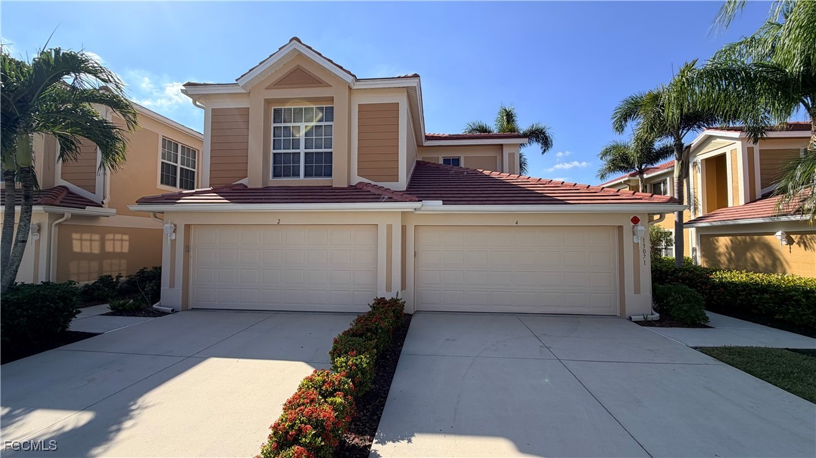 13071 Sandy Key Bend, Unit 304 North Fort Myers, FL 33903 - Photo 2 of 37 a view of a house with a large window and potted plants