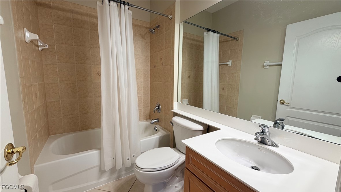 13071 Sandy Key Bend, Unit 304 North Fort Myers, FL 33903 - Photo 25 of 37 a bathroom with a sink toilet and shower