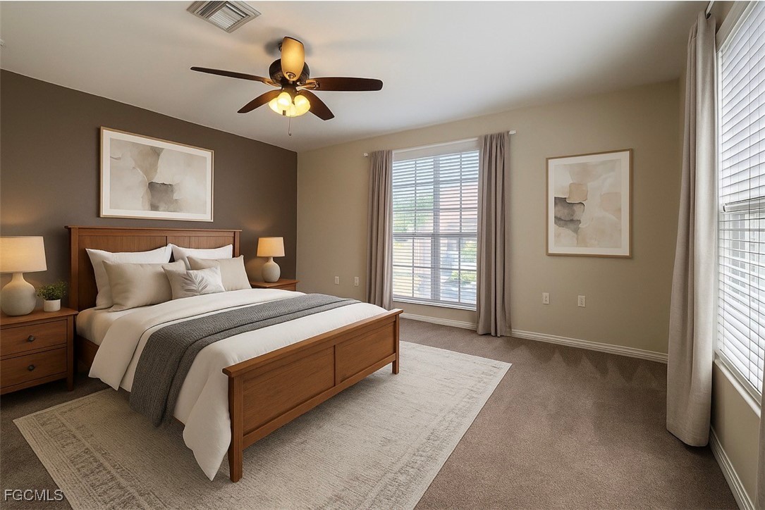 13071 Sandy Key Bend, Unit 304 North Fort Myers, FL 33903 - Photo 26 of 37 a spacious bedroom with a bed and window