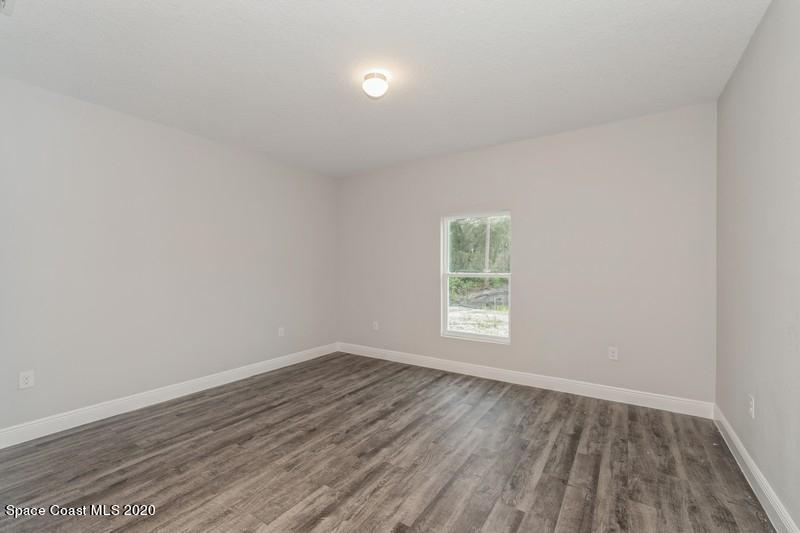 3223 Telesca Road Southeast Palm Bay, FL 32909 - Photo 11 of 17 10_1462LeewardAvenue_178002_PrimaryBedro