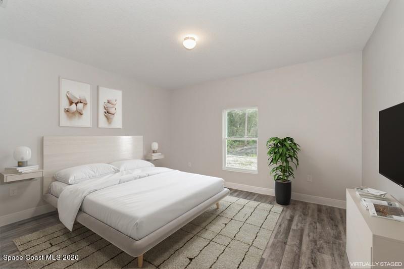 3223 Telesca Road Southeast Palm Bay, FL 32909 - Photo 10 of 17 09_1462LeewardAvenue_14_PrimaryBedroom_F