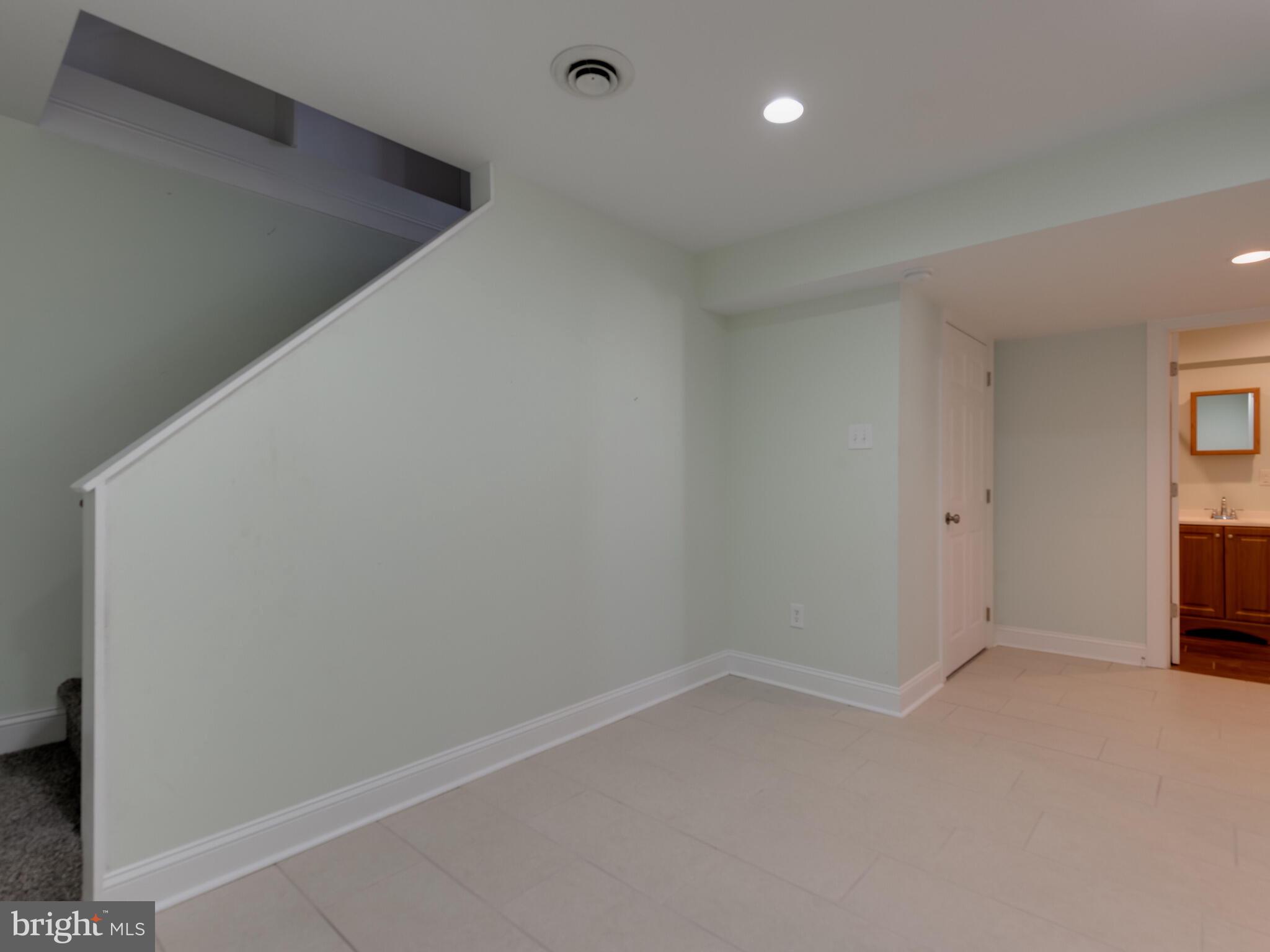 855 Highspire Road Glenmoore, PA 19343 - Photo 27 of 45 Basement FR w ceramic tile looking to Full Bath