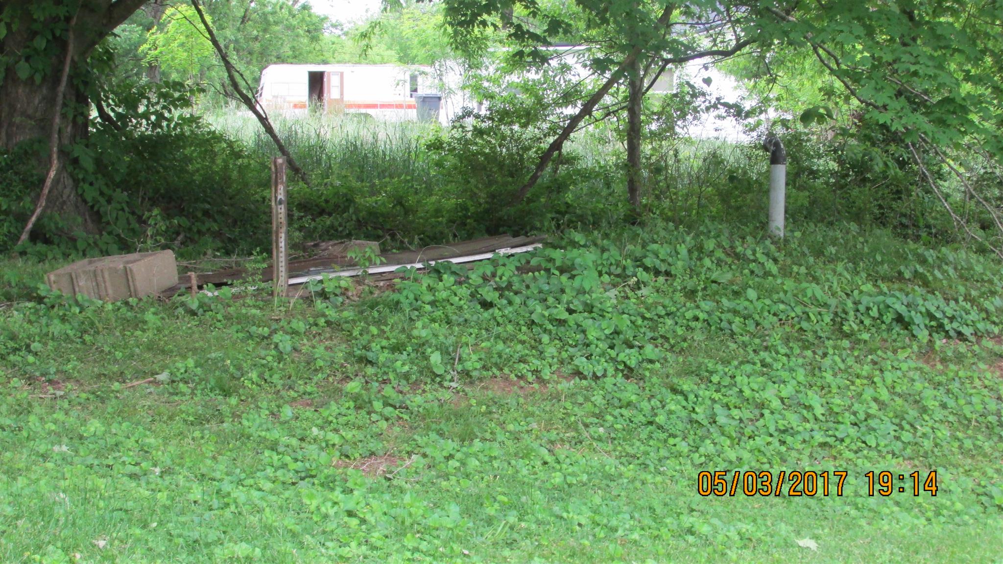 308 Fountainhead Road Portland, TN 37148 - Photo 7 of 8 STORM SHELTER MOUND WITH BREATHER PIPE TO RIGHT