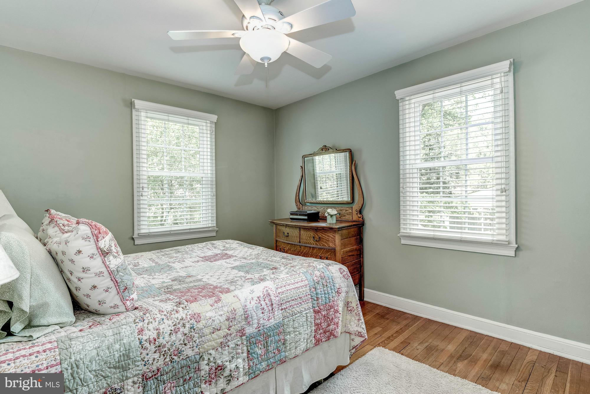 9109 Eton Road Silver Spring, MD 20901 - Photo 11 of 30 a bedroom with a large bed and a window