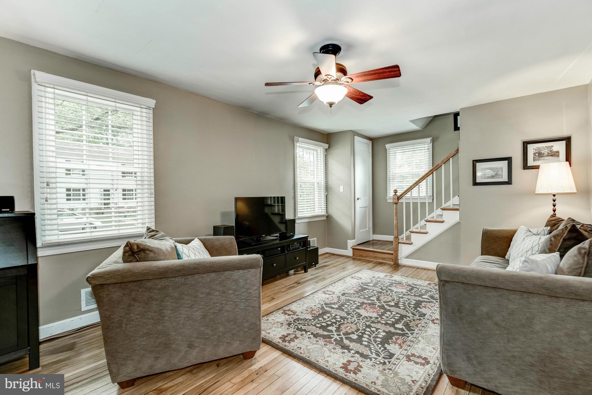9109 Eton Road Silver Spring, MD 20901 - Photo 3 of 30 a living room with furniture and a flat screen tv