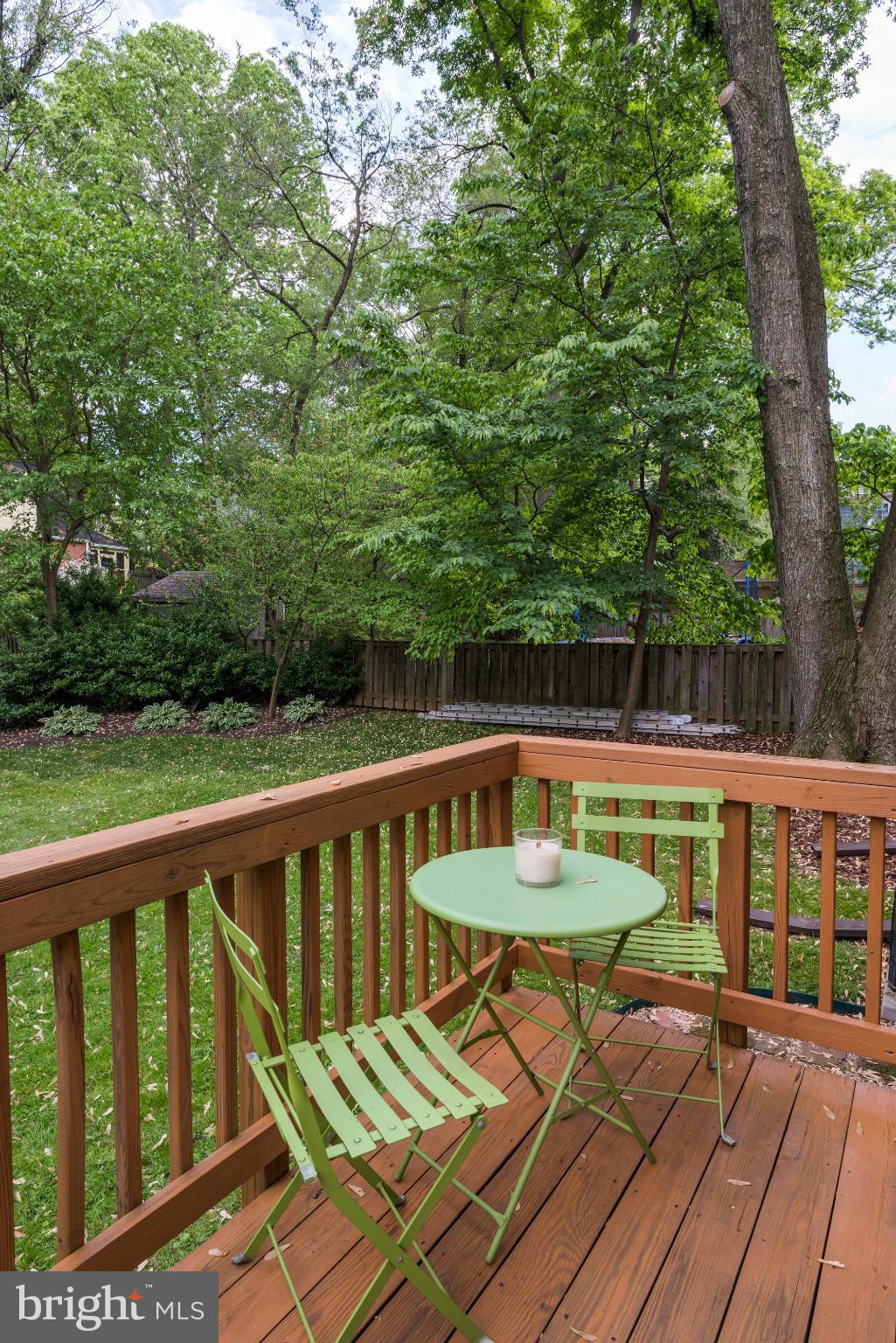 9109 Eton Road Silver Spring, MD 20901 - Photo 24 of 30 a view of a chairs and table on the deck