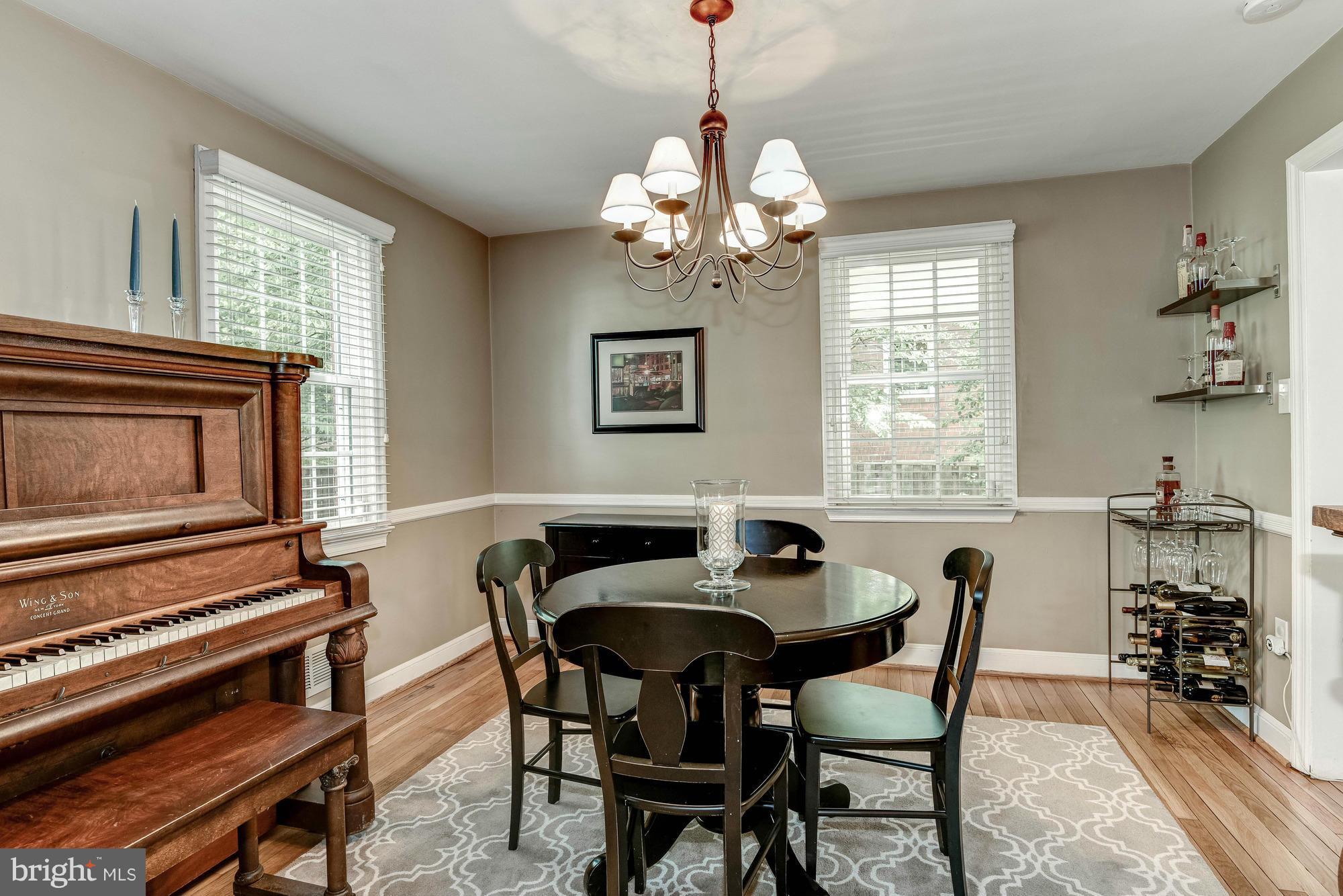 9109 Eton Road Silver Spring, MD 20901 - Photo 6 of 30 a view of a dining room with furniture window and wooden floor