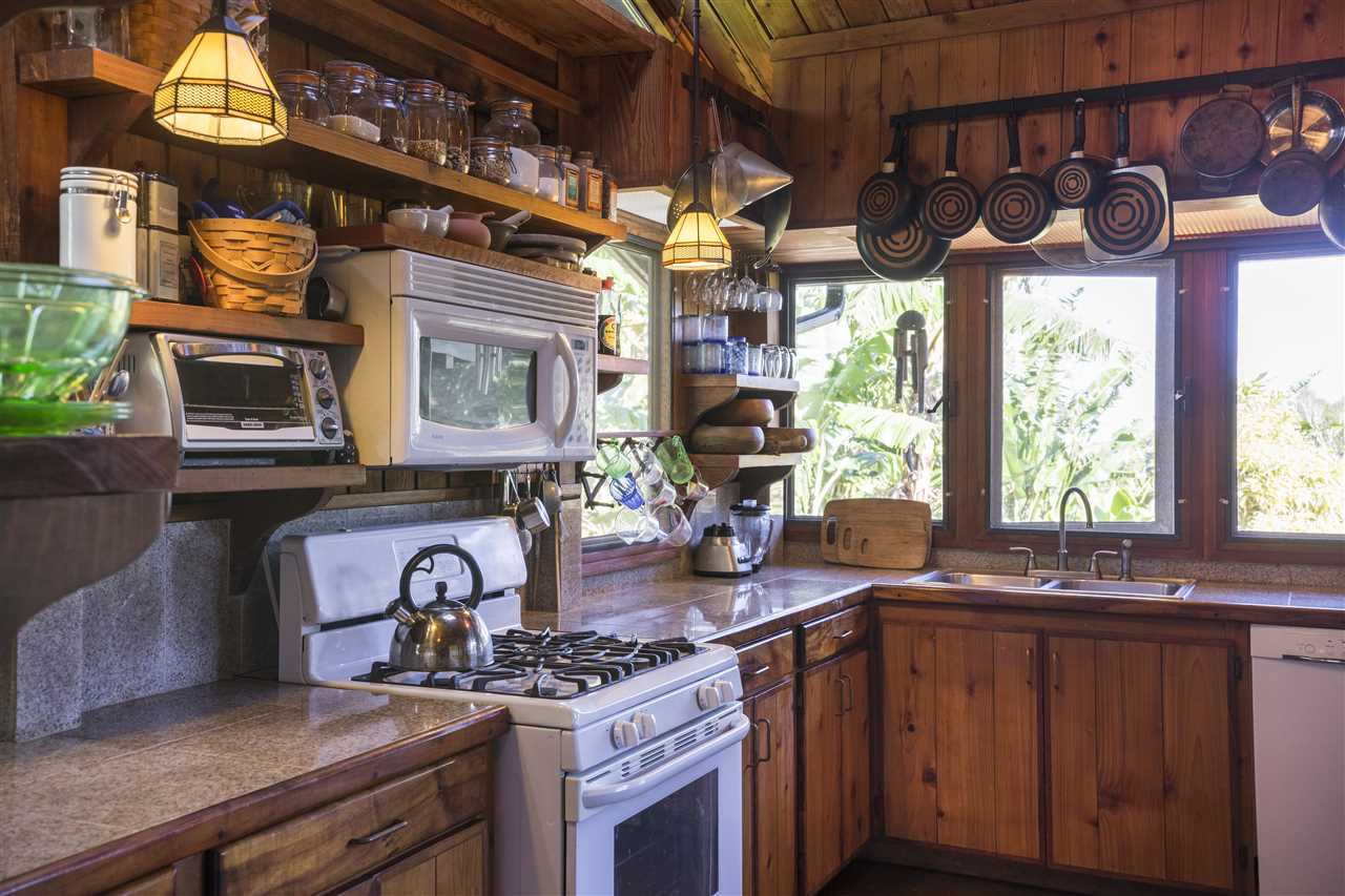 2555 Lemi Place Haiku, HI 96708 - Photo 12 of 30 a kitchen with a stove and a sink