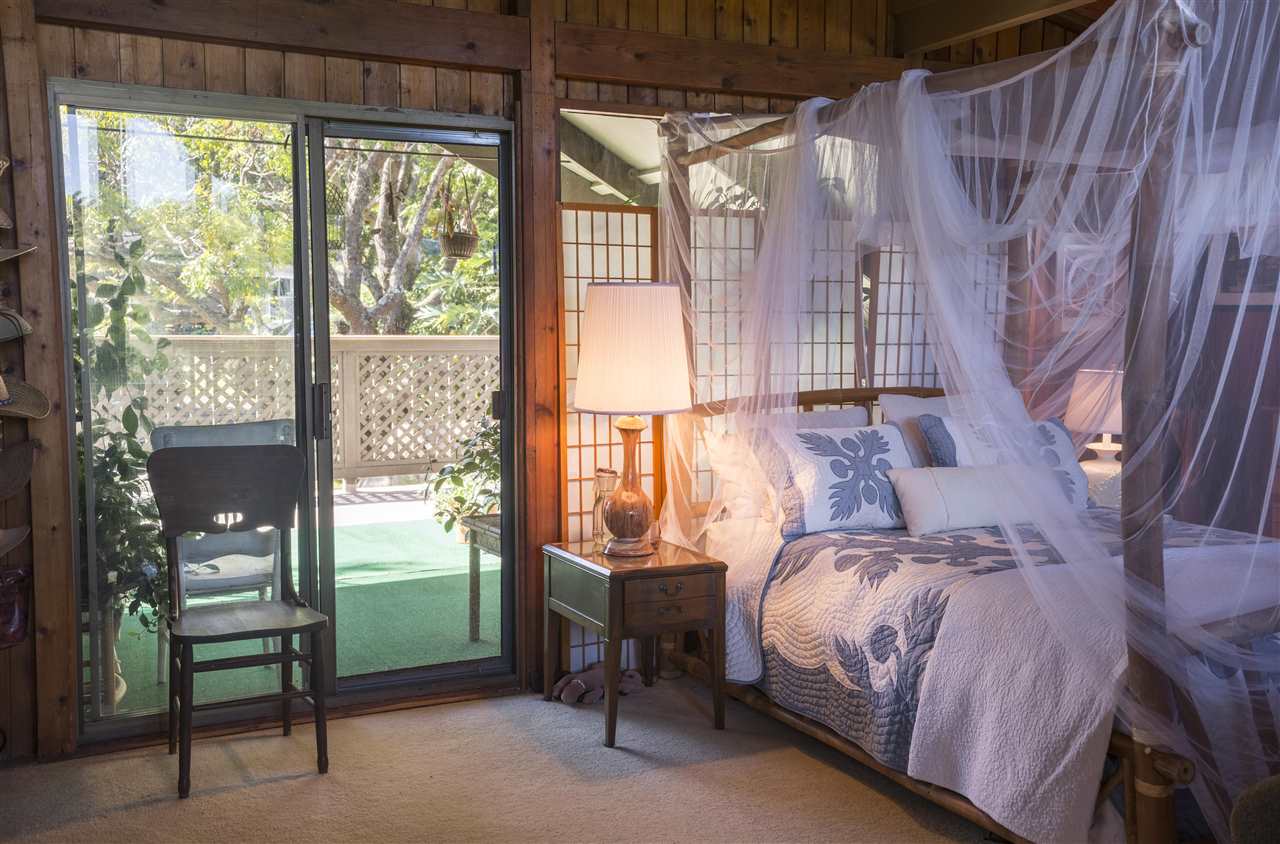 2555 Lemi Place Haiku, HI 96708 - Photo 16 of 30 a bed room with a bed and a chair
