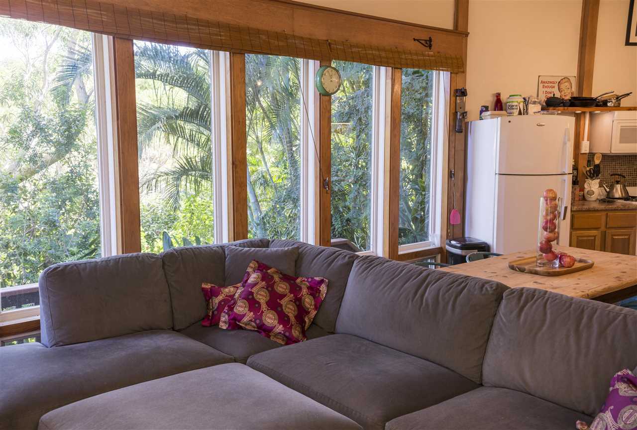 2555 Lemi Place Haiku, HI 96708 - Photo 23 of 30 a living room with furniture and large windows