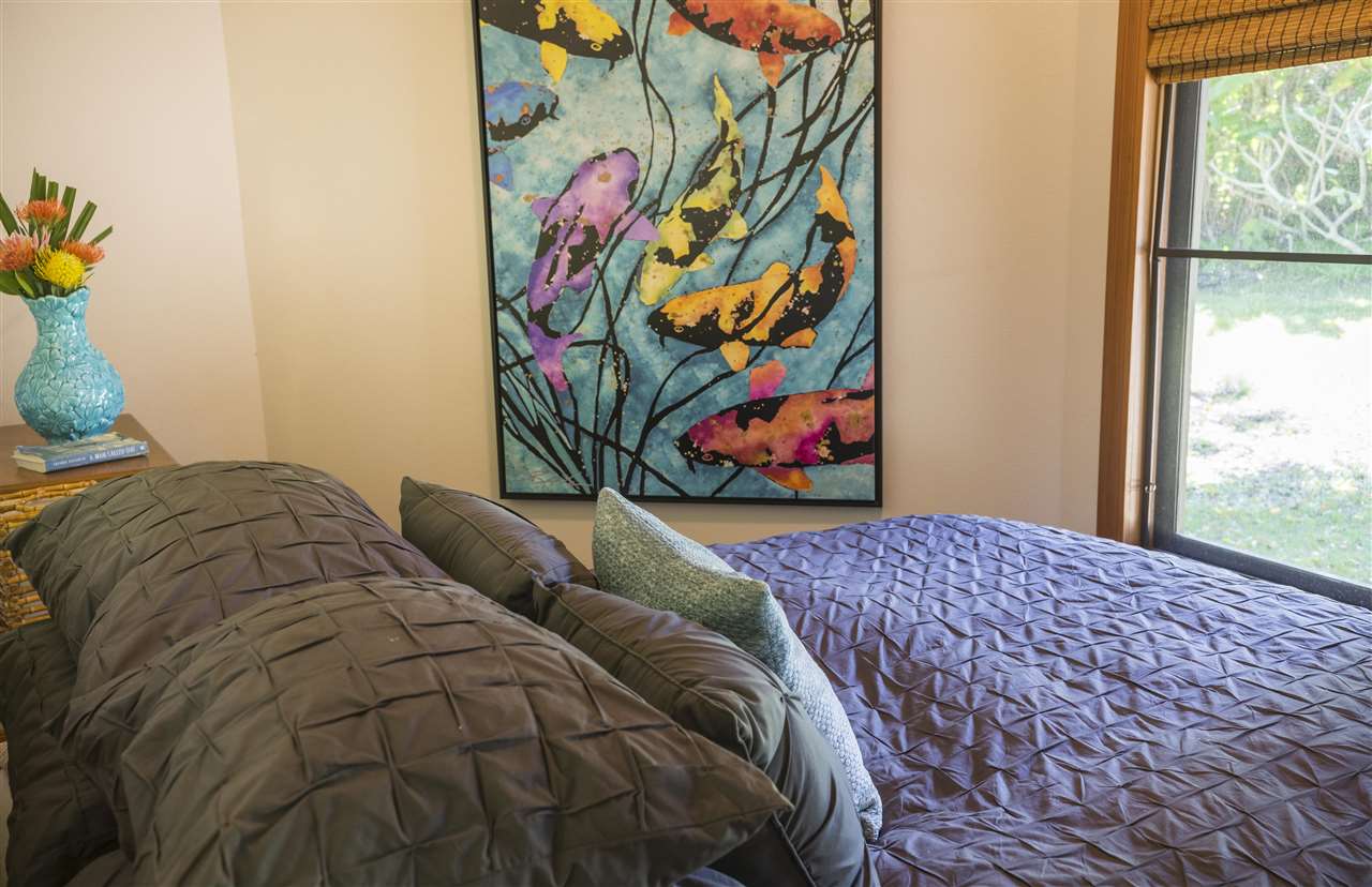 2555 Lemi Place Haiku, HI 96708 - Photo 25 of 30 a bed with a bed and painting on the wall