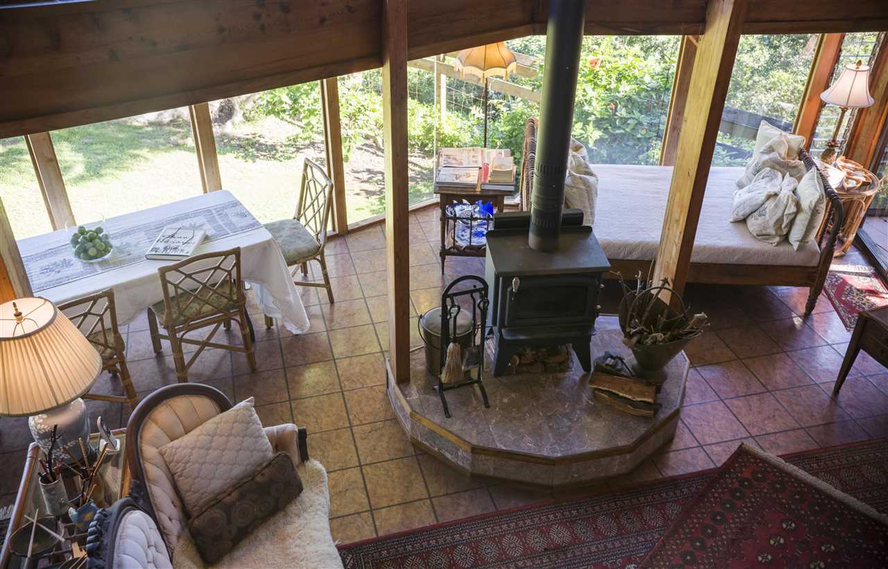 2555 Lemi Place Haiku, HI 96708 - Photo 9 of 30 a living room with furniture and a floor to ceiling window