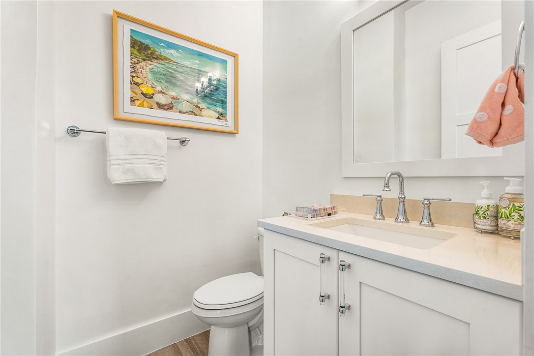 636 Cypress Road Vero Beach, FL 32963 - Photo 17 of 32 a bathroom with a sink vanity and toilet
