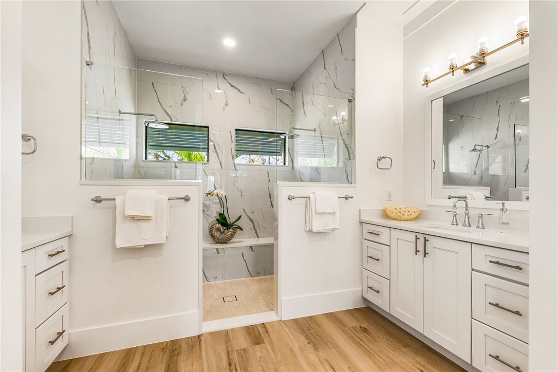 636 Cypress Road Vero Beach, FL 32963 - Photo 22 of 32 a kitchen with white cabinets and refrigerator