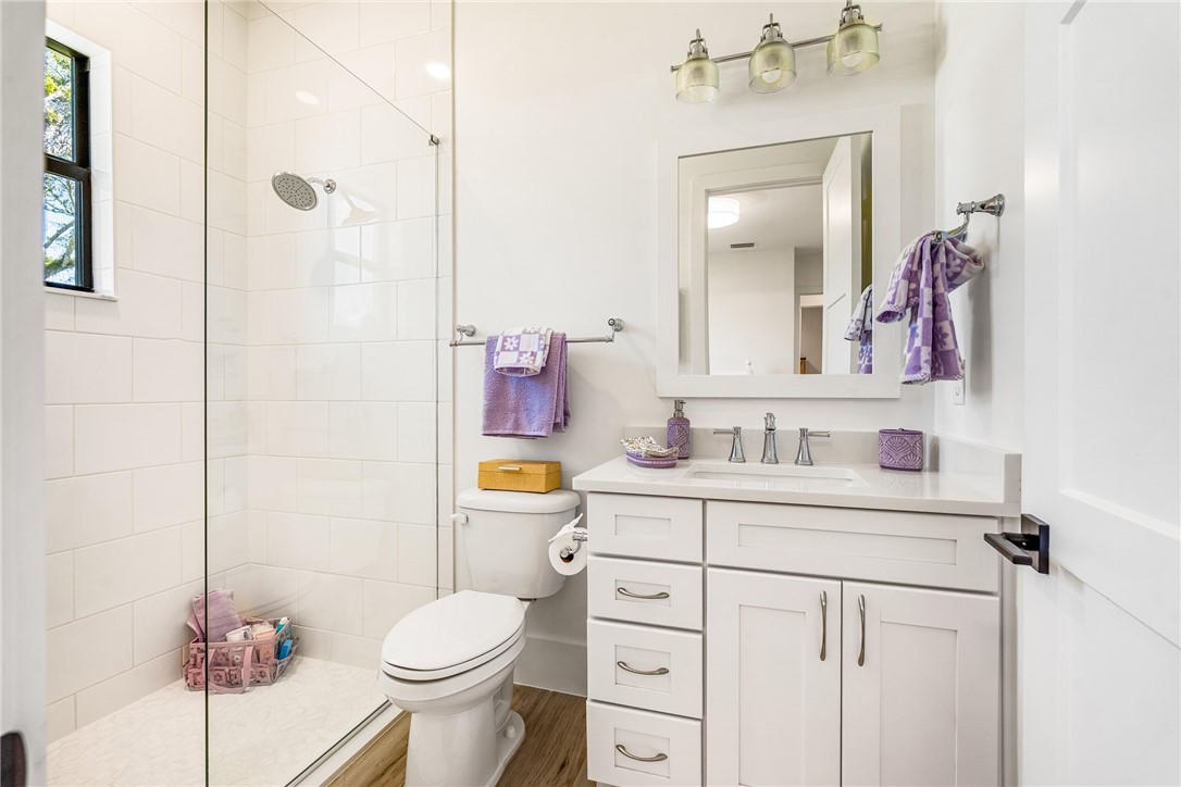 636 Cypress Road Vero Beach, FL 32963 - Photo 23 of 32 a bathroom with a sink toilet vanity and shower
