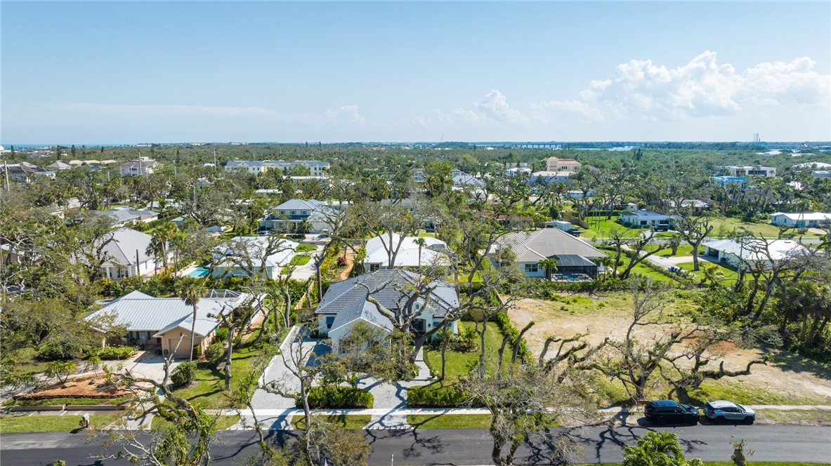636 Cypress Road Vero Beach, FL 32963 - Photo 31 of 32 an aerial view of residential houses with outdoor space and trees