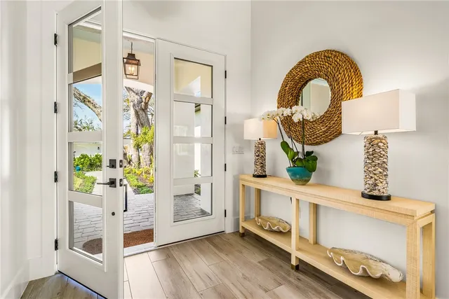 a view of living room with furniture and wooden floor