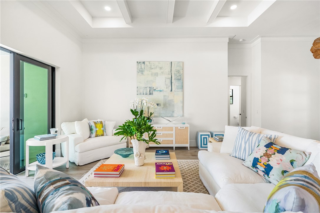 636 Cypress Road Vero Beach, FL 32963 - Photo 6 of 32 a living room with furniture fireplace and potted plant