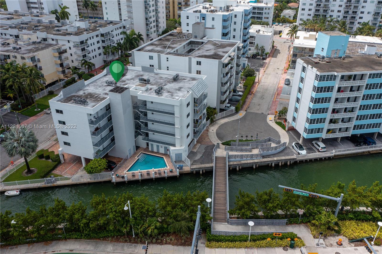 1674 Bay Road, Unit 504 Miami Beach, FL 33139 - Photo 23 of 25 an aerial view of a house with a garden and lake view
