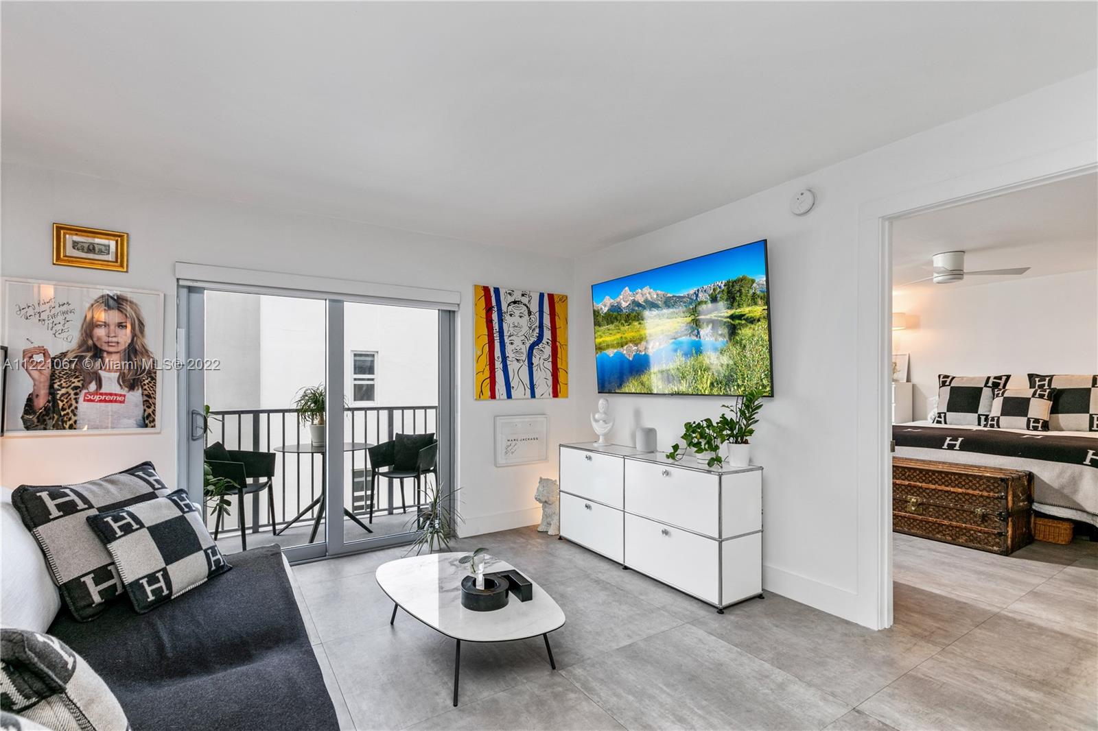 1674 Bay Road, Unit 504 Miami Beach, FL 33139 - Photo 6 of 25 a living room with furniture and a table