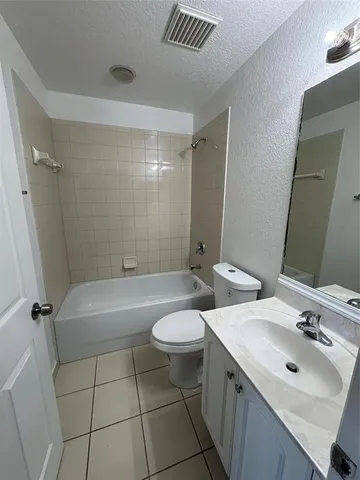 a view of a swimming pool with a lounge chair