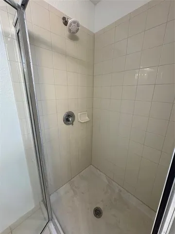 a view of a room with wooden floor and carpet