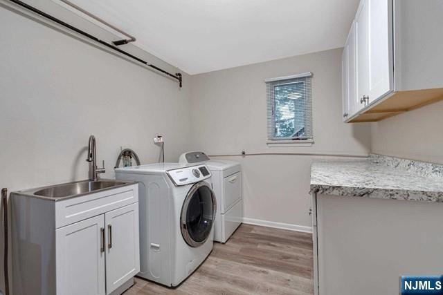 32 Rock Road Englewood Cliffs, NJ 07632 - Photo 28 of 30 a utility room with sink dryer and washer