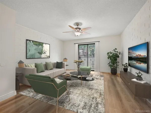 a living room with furniture potted plant and a window
